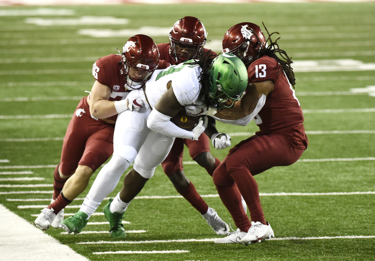 DJ Johnson carries defenders with him as he fights for yards after the catch in a game against the Washington State Cougars at Martin Stadium in Pullman, Washington on November 14, 2020.